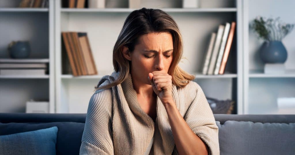 women coughing from bad air quality